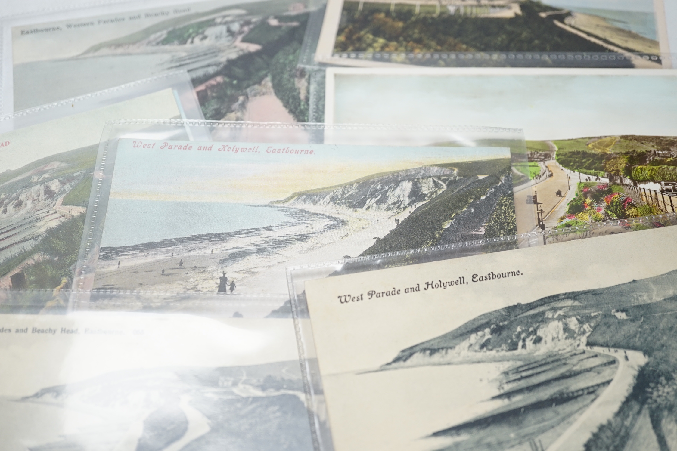 A large quantity of early to mid 20th century postcards of Eastbourne and the surrounding area, all in individual protective sleeves (in two boxes)